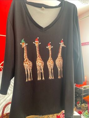 Black long-sleeve v-neck top with 4 giraffes in Santa hats - Size XL